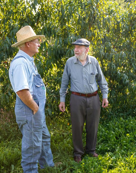 Grandpa loved to share and improve his knowledge. Here he is discussing peach varieties and culture with his good friend Paul Friday, breeder of all the Flamin'Fury peach varieties.